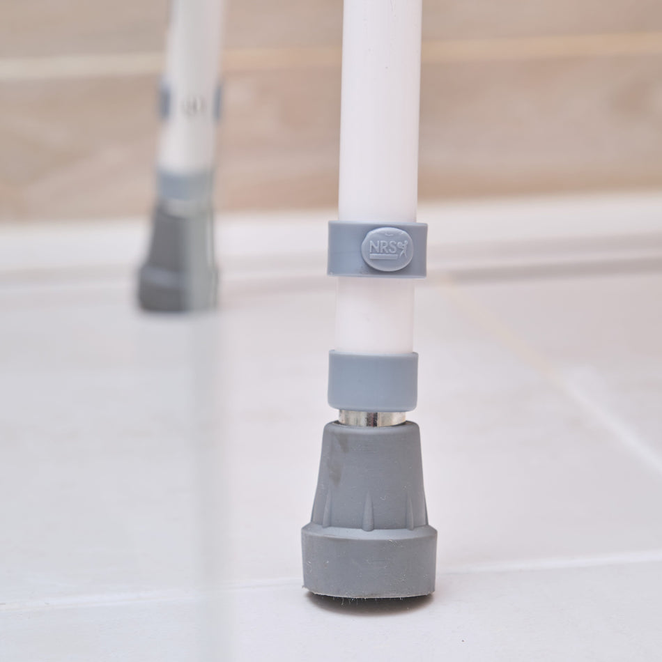 Front view of NRS Stackable Adjustable Shower Chair showing drainage holes in the seat and the supportive backrest design.