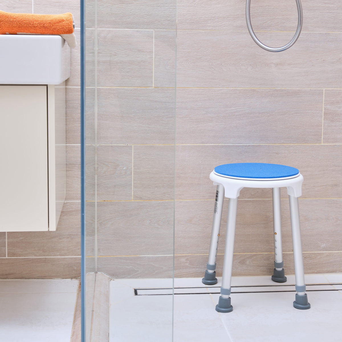 Top view of NRS Swivel Shower Stool showing drainage holes in the seat for quick water runoff.