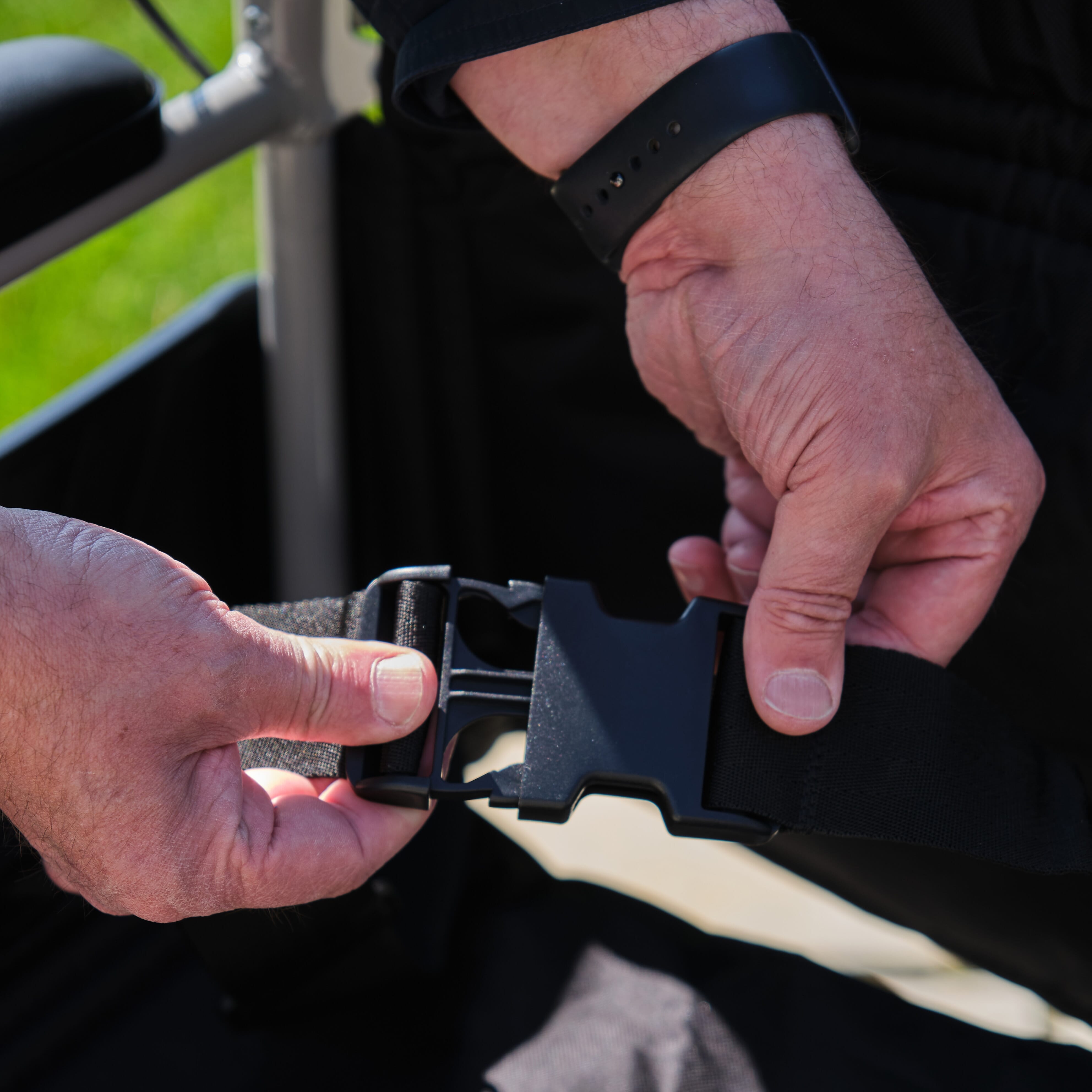 Lifestyle image of NRS Transit-Lite Attendant Controlled Wheelchair being used in a real-life setting.