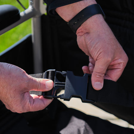 Lifestyle image of NRS Transit-Lite Attendant Controlled Wheelchair being used in a real-life setting.