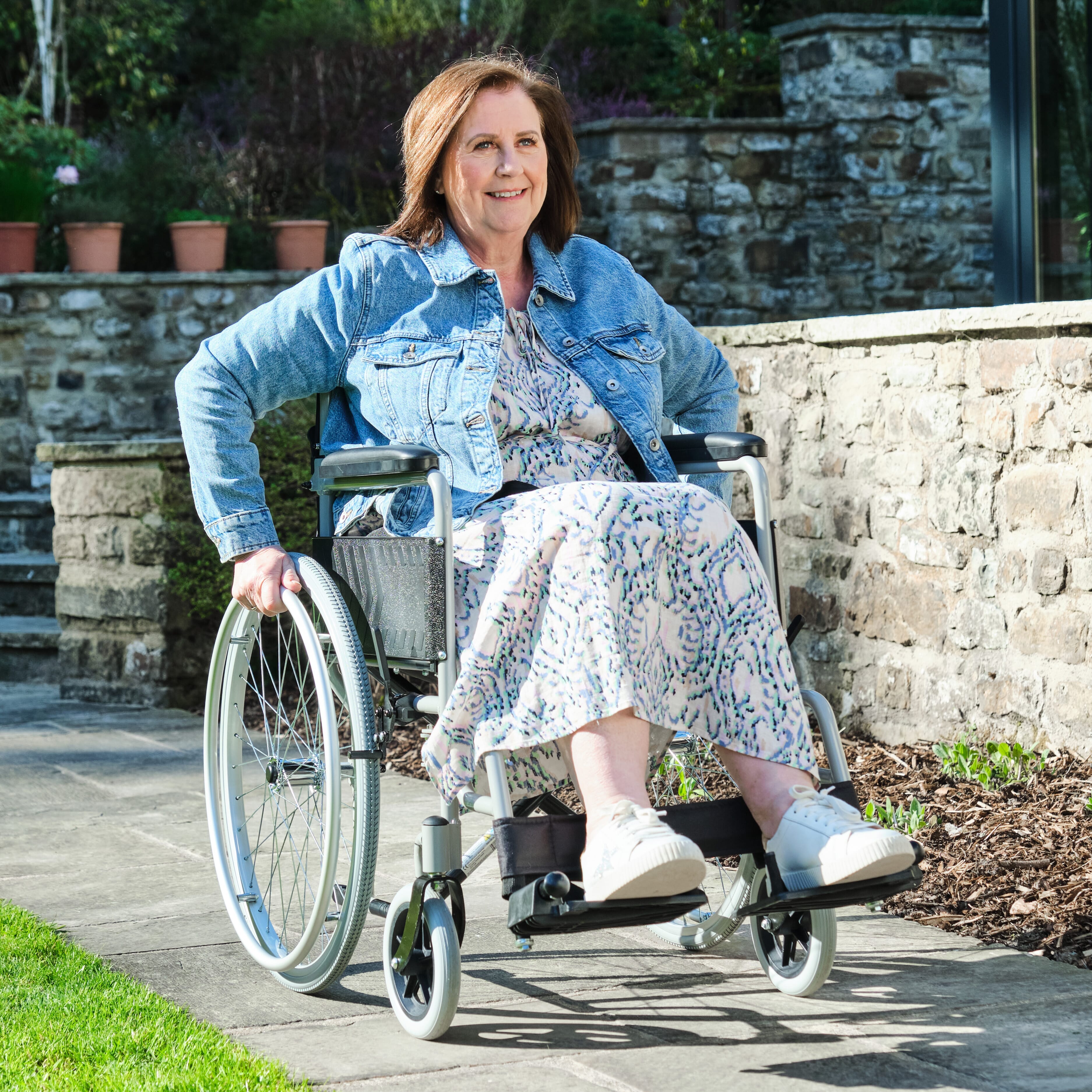 Alternative view of NRS Transit-Lite Self-Propelled Wheelchair, showing different angle or usage.