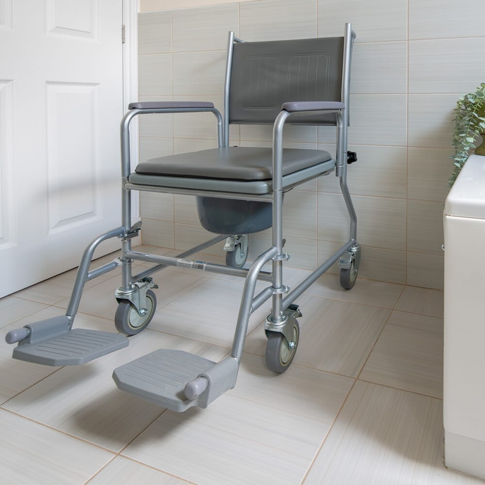 NRS Wheeled Commode with lid closed, highlighting the padded seat and discreet design.