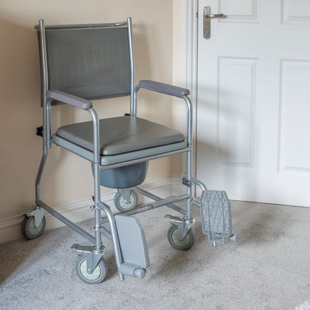 Close-up of the flushing pump, lid or handle on NRS Wheeled Commode showing easy operation.