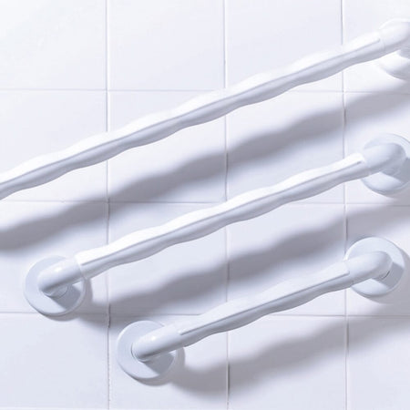 Close-up of a wall mounting plate on Natural Grip Plastic Straight Grab Rail grab rail showing screw holes for secure installation.