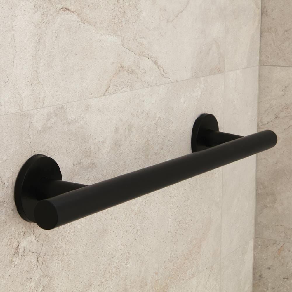 Close-up of a wall mounting plate on Nymas Matt Black Straight Grab Rail grab rail showing screw holes for secure installation.