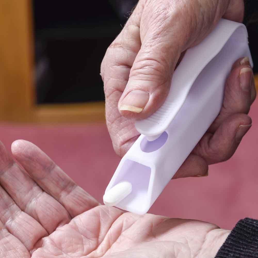 Diagram or packaging of Pill Dispenser Remover highlighting dimensions or features.