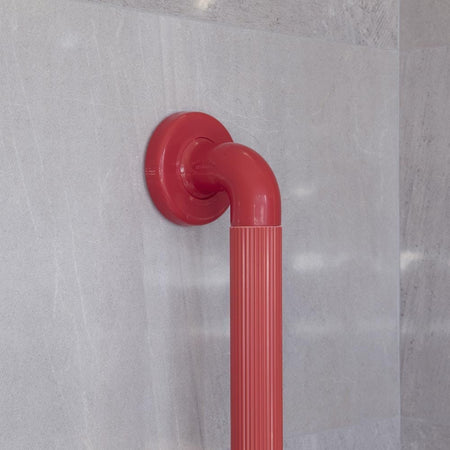 Close-up of a wall mounting plate on Plastic Fluted Grab Rail-450mm 18-Red grab rail showing screw holes for secure installation.