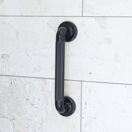 Full view of Plastic Fluted Grab Rail grab rail with circular wall plates and a textured grip, designed to provide support in bathrooms and other areas.