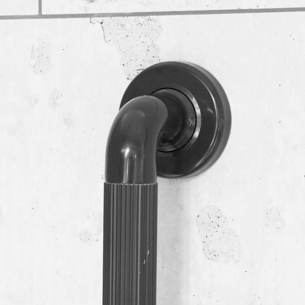 Close-up of a wall mounting plate on Plastic Fluted Grab Rail grab rail showing screw holes for secure installation.