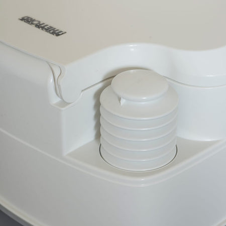 Diagram or packaging of Porta Potti 165 Portable Flushing Toilet highlighting dimensions or features.