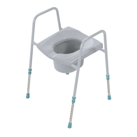 Prima Flat Pack Classic Toileting Commode with lid raised showing the open seat and removable commode pan, with supportive arms and adjustable height on a plain background.