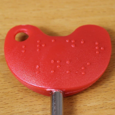 Image of RADAR National Key Scheme Key With Easy Turn Red Handle on a plain background.