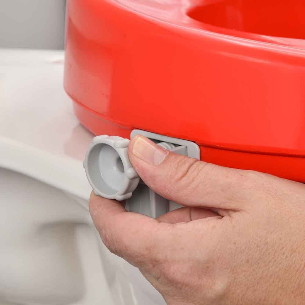 Diagram or packaging of Red Raised Toilet Seat highlighting dimensions or features.