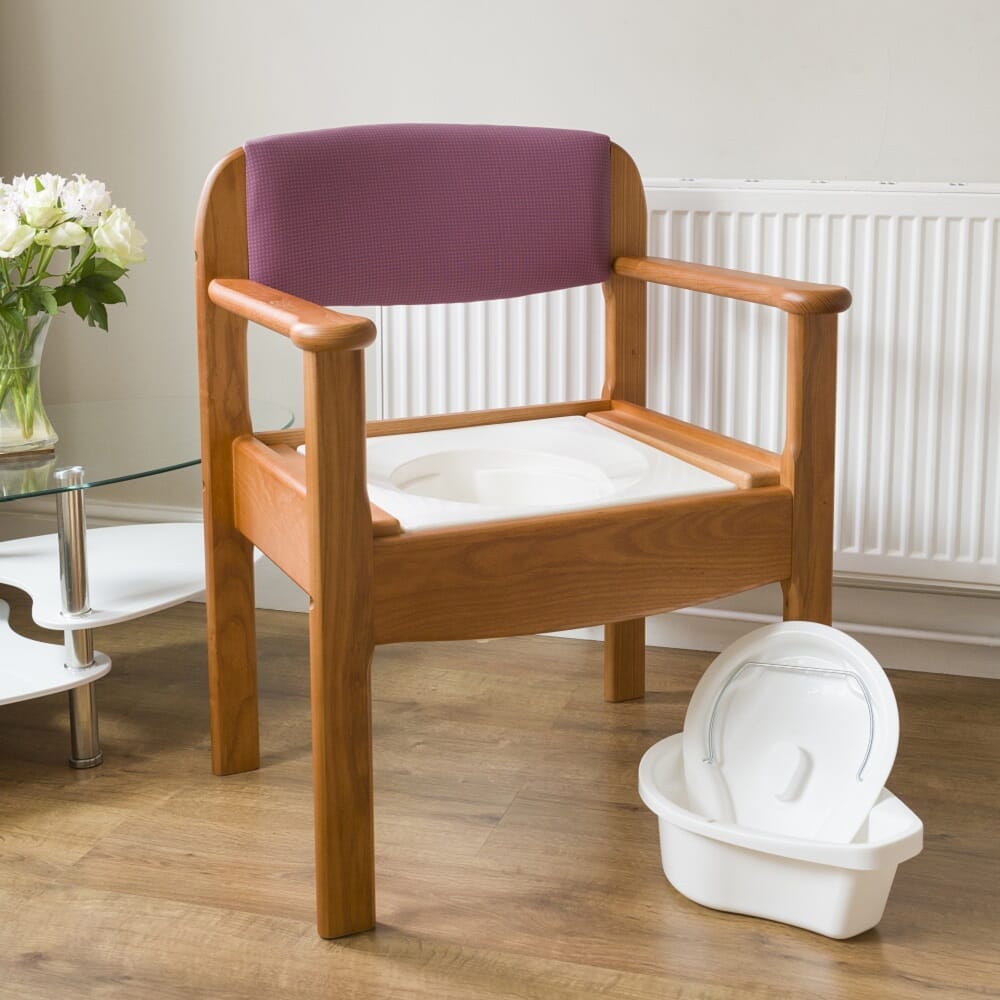 Royale Extra Wide Commode Chair with lid closed, highlighting the padded seat and discreet design.