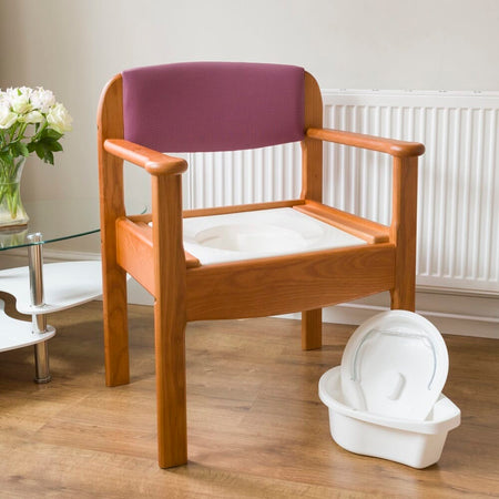 Royale Extra Wide Commode Chair with lid closed, highlighting the padded seat and discreet design.