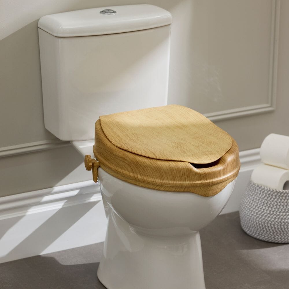 Image of Sanctuary Oak Effect Raised Toilet Seat With Lid on a plain background.