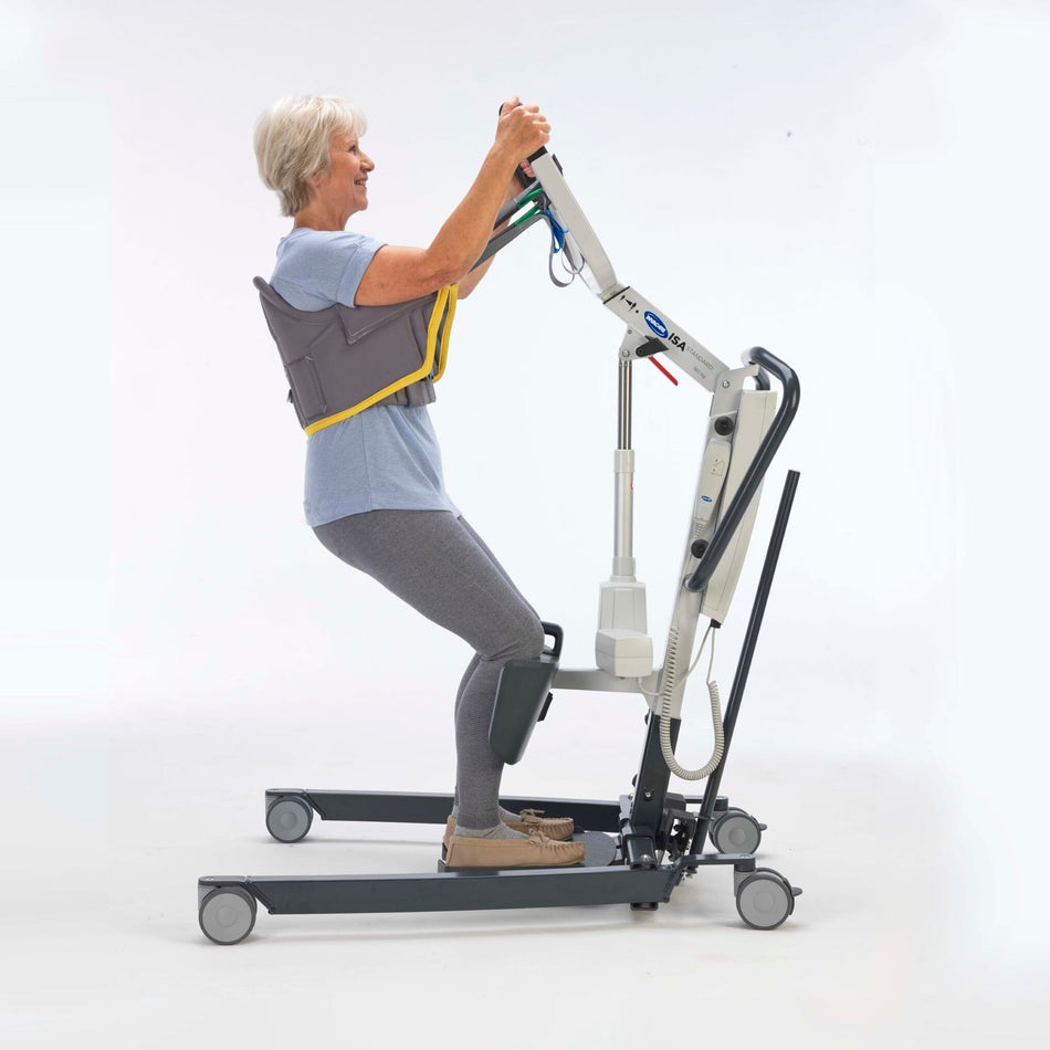 Full view of Stand Aid Sling mobile hoist on a plain background, showing the wheeled base, upright mast and sling attachment.