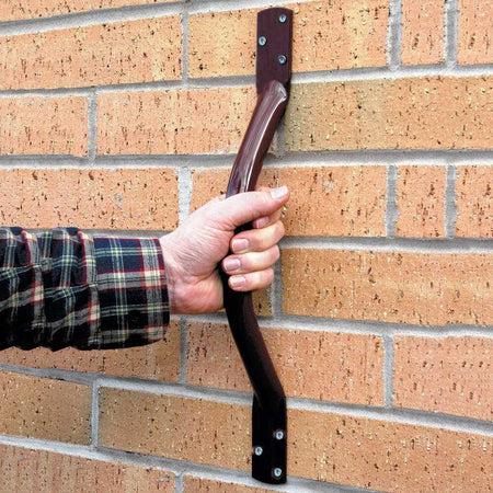 Close-up of a wall mounting plate on Steel Grab Rail grab rail showing screw holes for secure installation.