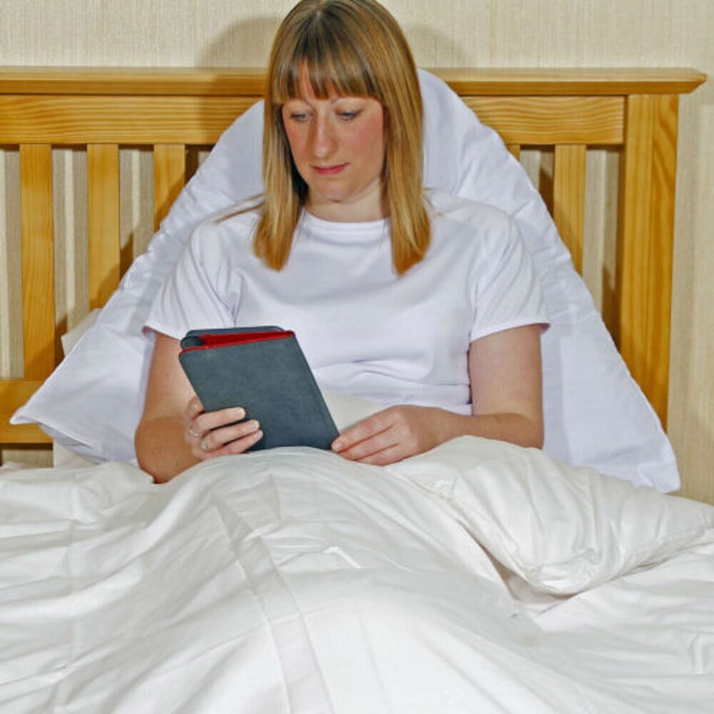 V-Shaped Polycotton Pillowcase white cushion on a seat or chair, demonstrating added comfort and pressure relief.