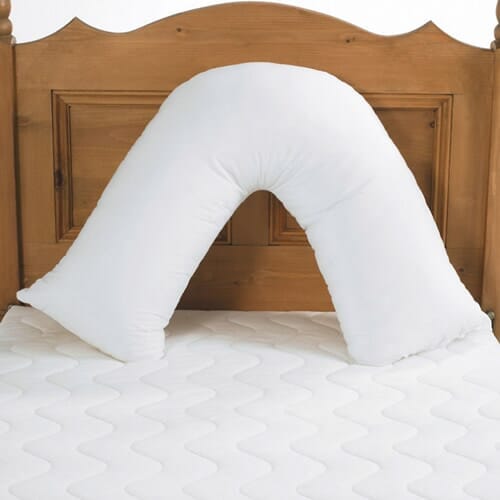 V Shaped Back Support Pillow cushion on a seat or chair, demonstrating added comfort and pressure relief.
