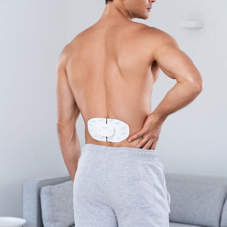 Lifestyle image of Wireless Electrode Set for Beurer EM 70 TENS EMS Device being used in a real-life setting.